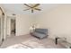 Cozy bedroom featuring a futon, ceiling fan, and natural light from the window at 3425 E Russell Rd # 240, Las Vegas, NV 89120