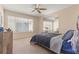 Comfortable bedroom with a large window, ceiling fan, and ample natural light at 3425 E Russell Rd # 240, Las Vegas, NV 89120