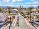 Exterior view of a gated community entrance with well-maintained landscaping and community signage at 3425 E Russell Rd # 240, Las Vegas, NV 89120