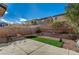 Outdoor patio space with artificial turf, and landscaping at 4727 Sweeping Glen St, Las Vegas, NV 89129