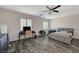 Bedroom featuring a ceiling fan, and natural light and wood-look floors at 4727 Sweeping Glen St, Las Vegas, NV 89129