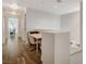 Upstairs hallway with a work area, desk, chair, and natural light from a window at the end of the hallway at 4727 Sweeping Glen St, Las Vegas, NV 89129