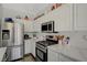 Well-lit kitchen boasts stainless steel appliances, ample storage, and sleek countertops for meal preparation at 4727 Sweeping Glen St, Las Vegas, NV 89129