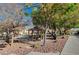 A gazebo is surrounded by trees, green space and walking path in the neighborhood park at 4727 Sweeping Glen St, Las Vegas, NV 89129