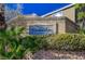 An elegant stone sign reading Stoneridge sits atop a brick wall, surrounded by lush greenery at 4727 Sweeping Glen St, Las Vegas, NV 89129