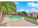 Backyard oasis with a pool, putting green, and shed at 5484 Oatfield St, North Las Vegas, NV 89081