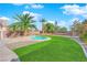 Private backyard with a pool and lush grass at 5484 Oatfield St, North Las Vegas, NV 89081