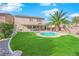 Home features a backyard with a pool and covered patio at 5484 Oatfield St, North Las Vegas, NV 89081