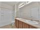 Bathroom boasts dual sinks, tub and shower at 5484 Oatfield St, North Las Vegas, NV 89081