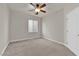 Spacious bedroom with ceiling fan and neutral carpeting at 5484 Oatfield St, North Las Vegas, NV 89081