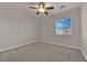 Well-lit bedroom featuring a ceiling fan and window coverings at 5484 Oatfield St, North Las Vegas, NV 89081