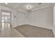 Elegant dining room with high ceilings, chandelier, and neutral decor at 5484 Oatfield St, North Las Vegas, NV 89081