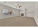 Bright living room featuring a fireplace and ceiling fan at 5484 Oatfield St, North Las Vegas, NV 89081