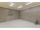 Finished basement with concrete walls and shelving at 62 Golf Estates Dr, Las Vegas, NV 89141