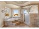 Large bathroom with soaking tub, walk-in shower, and stunning views at 62 Golf Estates Dr, Las Vegas, NV 89141