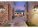 Private courtyard with fire pit and lighting at 62 Golf Estates Dr, Las Vegas, NV 89141