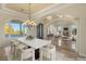 Bright dining room with chandelier and large windows at 62 Golf Estates Dr, Las Vegas, NV 89141