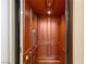 Elegant wood-paneled elevator with detailed trim at 62 Golf Estates Dr, Las Vegas, NV 89141