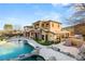 Luxury home with pool and landscaped grounds, offering stunning views at 62 Golf Estates Dr, Las Vegas, NV 89141