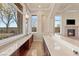 Wet bar with granite countertop and custom cabinetry at 62 Golf Estates Dr, Las Vegas, NV 89141