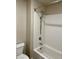 Bathroom featuring a bathtub and shower combination with white subway tile at 7544 Pink Mimosa Ave, Las Vegas, NV 89113