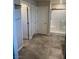 Tiled bathroom floor leading to water closet and shower with glass door at 7544 Pink Mimosa Ave, Las Vegas, NV 89113