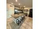 Kitchen featuring granite countertops, a large island with barstool seating, and stainless steel appliances at 7544 Pink Mimosa Ave, Las Vegas, NV 89113