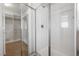 Bathroom with a shower, mirrored closet doors, and linen storage at 9936 Coyote Echo Ct, Las Vegas, NV 89166