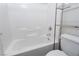 Clean bathroom with a bathtub and shelving unit at 9936 Coyote Echo Ct, Las Vegas, NV 89166