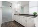 Bathroom features a double vanity and a view into the bedroom at 9936 Coyote Echo Ct, Las Vegas, NV 89166