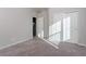 Sunny bedroom with carpet flooring and double door closet at 9936 Coyote Echo Ct, Las Vegas, NV 89166