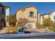 Two-story house with attached garage at 9936 Coyote Echo Ct, Las Vegas, NV 89166