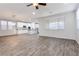 Open living room and kitchen with wood-look floors at 9936 Coyote Echo Ct, Las Vegas, NV 89166