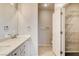 Bathroom with double vanity, quartz countertop and linen closet at 2601 Darda St, Henderson, NV 89044