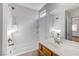 A well-lit bathroom featuring a white tub and shower combination and a vanity with a sink and mirror at 4788 Frankfurt Ct, Las Vegas, NV 89147