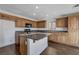 Modern kitchen with granite island and dark wood cabinets at 4788 Frankfurt Ct, Las Vegas, NV 89147