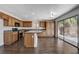 Modern kitchen featuring granite countertops, stainless steel appliances, and access to the backyard at 4788 Frankfurt Ct, Las Vegas, NV 89147