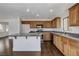 Well-lit kitchen with a granite island, lots of counter space, and wood floors at 4788 Frankfurt Ct, Las Vegas, NV 89147