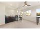 Upstairs bonus room featuring built-in bar area and multiple windows for natural light at 1282 Calcione Dr, Henderson, NV 89011