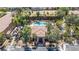 Aerial view of community clubhouse and pool with lush landscaping at 2151 Hussium Hills St # 207, Las Vegas, NV 89108