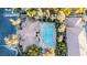 Stunning aerial view of the community pool and clubhouse nestled amongst lush landscaping at 2151 Hussium Hills St # 207, Las Vegas, NV 89108