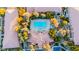 Overhead view of the community pool and surrounding mature trees and condo buildings at 2151 Hussium Hills St # 207, Las Vegas, NV 89108