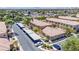 Aerial view of Rancho Lake Condominiums with a parking lot, covered parking, and a vibrant community at 2151 Hussium Hills St # 207, Las Vegas, NV 89108