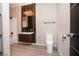 Modern bathroom featuring dark wood cabinets, a toilet, and a shower/tub at 2151 Hussium Hills St # 207, Las Vegas, NV 89108