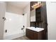 Bathroom features a shower-tub combo, modern vanity, and sleek, black fixtures at 2151 Hussium Hills St # 207, Las Vegas, NV 89108