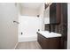 Modern bathroom with white tiled shower and dark wood cabinets at 2151 Hussium Hills St # 207, Las Vegas, NV 89108