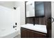 Bathroom features a shower-tub combo, modern vanity, and sleek, black fixtures at 2151 Hussium Hills St # 207, Las Vegas, NV 89108