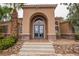 Elegant building entrance with stone accents and a manicured landscape creating a welcoming atmosphere at 2151 Hussium Hills St # 207, Las Vegas, NV 89108