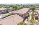 Aerial view of condo building showing roofing tile, desert landscaping, and unit numbers on building at 2151 Hussium Hills St # 207, Las Vegas, NV 89108