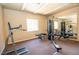 Bright fitness center featuring weight machines and a full-length mirror at 2151 Hussium Hills St # 207, Las Vegas, NV 89108